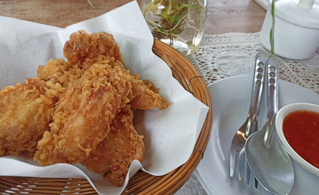 deep fried breaded crispy chicken wing with dipping sauceの写真素材