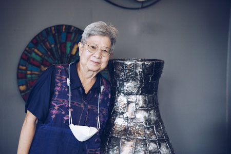 old elderly senior elder woman relaxing in living room. mature retirement lifestyleの写真素材