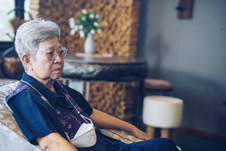 old elderly senior elder woman relaxing in living room. mature retirement lifestyleの写真素材
