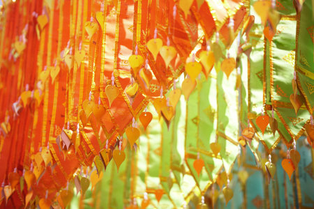 colorful traditional fabric flag decorating hanging in templeの写真素材