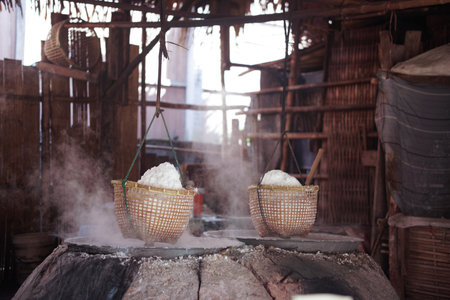 boiling saline solution in pan is traditional way for making mountain rock saltの写真素材