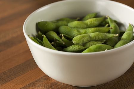 A bowl of steamed edamameの写真素材