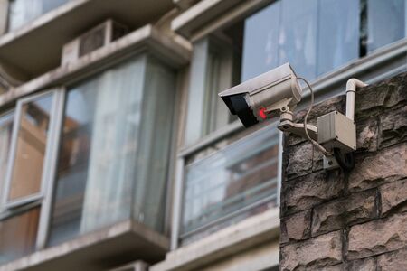Outdoor security CCTV mornitor in front of buildingの写真素材