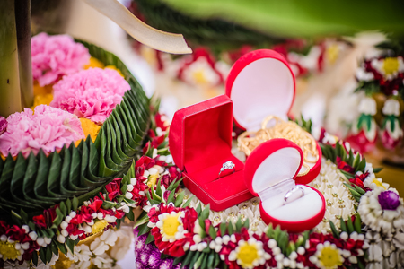 Dowry (gold necklace) on flower tray in Thai traditional weddingの写真素材
