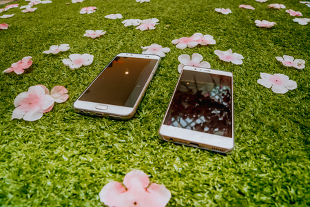 Couple smartphone on the groundの写真素材