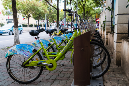 SHANGHAI, CHINA - APRIL, 2017: Green public bicycle in parking lot in Shanghaiのeditorial素材
