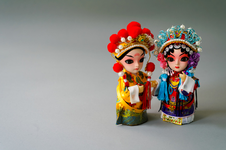 Traditional married Chinese dolls isolate on gray backgroundの写真素材