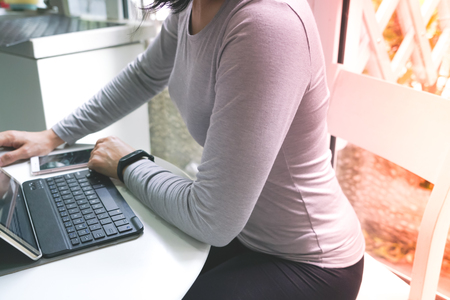 Young student women is using tablet computerの写真素材