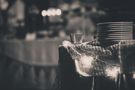 A batch of white dishes on the table with star lighting and blurred backgroundの写真素材