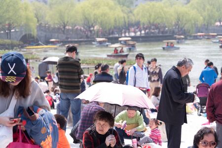 SHANGHAI, CHINA, APRIL 2017 - Shanghai peoples have outdoor on sunny day incoming summerのeditorial素材