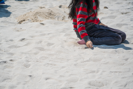 playground for the kid is white sand on sunny dayの写真素材