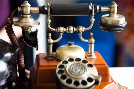Black gold antique vintage telephone, abstract of communicationの写真素材