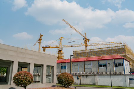 SHANGHAI, CHINA APRIL, 2017 : A crane is working on building construction site at Hi-Tech park industrial estateのeditorial素材