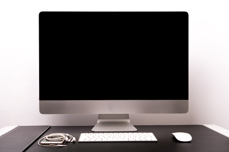 retina display with keyboard, mouse, smart phone and earphoneの写真素材