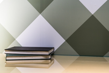 two diary books on the table near graphic wallの写真素材