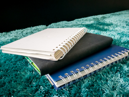 Top view stack of book on the carpetの写真素材