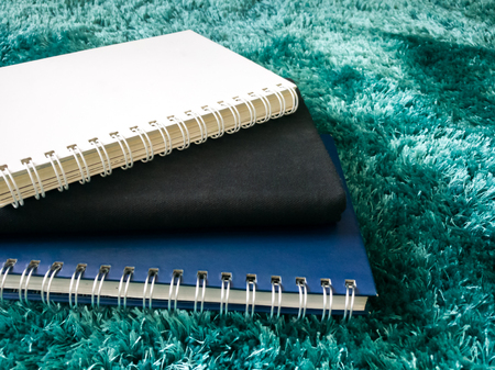 Top view stack of book on the carpetの写真素材