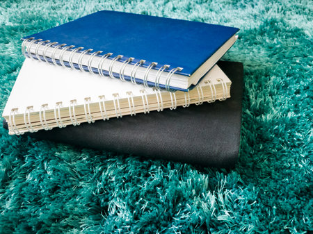 Top view stack of book on the carpet