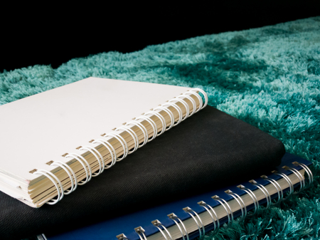 Top view stack of book on the carpetの写真素材