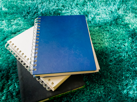 Top view stack of book on the carpetの写真素材