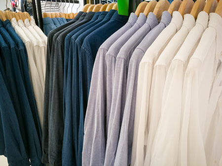 row of white and dark shirt on the shopping mallの写真素材
