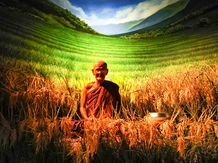 Pattaya Chonburi, Thailand, 27 July 2017 : the wax figure of Thai venerable monk with the rice treeのeditorial素材