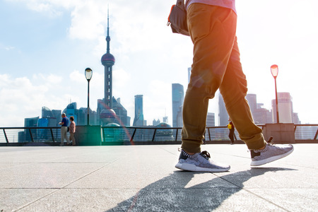 walking man in the summer at bund Shanghai city view backgroundの写真素材