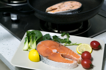 raw salmon steak with vegetable on plate, food and vegetable conceptの写真素材