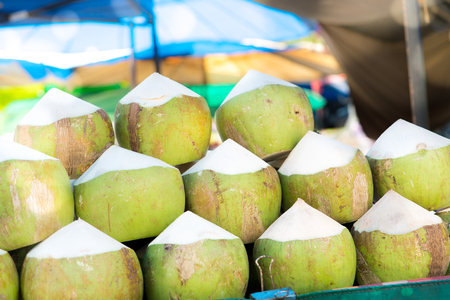 fresh coconut in the market, point of sale fresh coconut drinkの写真素材