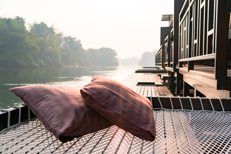 two pillow on the net at the rafting cottage terrace in the moring sunriseの写真素材