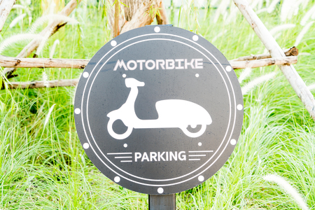 bicycle parking sign with green grass backgroundsの写真素材