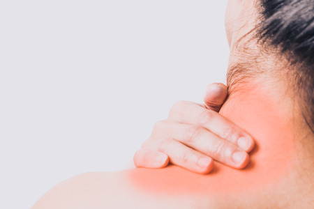closeup women neck and shoulder pain/injury with red highlights on pain area with white backgrounds, healthcare and medical conceptの写真素材