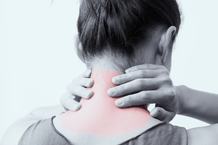 closeup women neck and shoulder pain/injury with red highlights on pain area with white backgrounds, healthcare and medical concept - B&W filterの写真素材