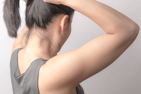 rear view of women tightening the hair, lifestyle conceptの写真素材
