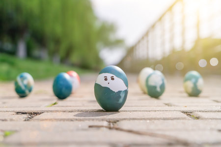 Happy easter, cute boy organic easter eggs, painting face on egg, easter holiday decorations, easter...