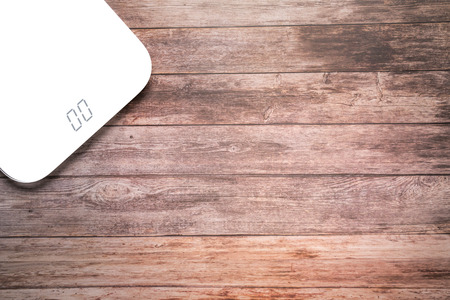 weight scale white digital on the wooden backgrounds health and fitness life conceptの写真素材