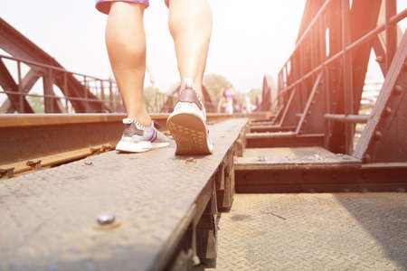 success man walking, traveler man walking to success on the steel with sunshine filterの写真素材