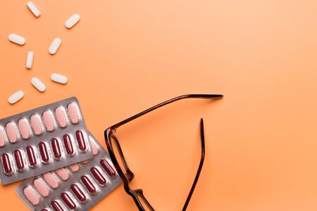 healthcare and medical concept medicine on the orange background with copy spaceの写真素材