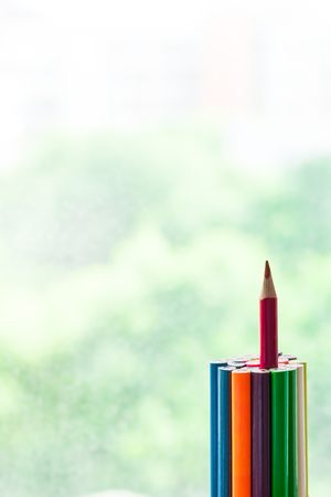 outstanding color pencil stand higher than other. successful and achievement conceptの写真素材