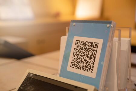 SHANGHAI, CHINA - MAY, 2018 : Qr code payment , online shopping , cashless technology concept. Shop in shopping center accepted digital pay without money , plastic tag on table ready for digital paymentのeditorial素材
