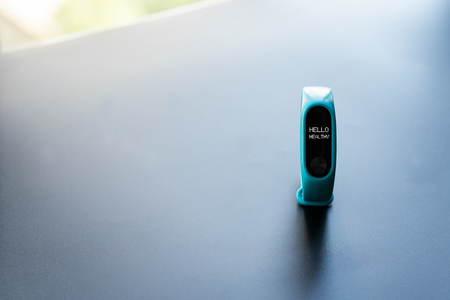 fitness smart band device blue color on black background with word Hello healthyの写真素材
