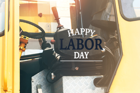 Labor Day Concept. excavator driver seat closeup with word Happy Labor Dayの写真素材