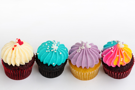Variety colorful cute cupcake on white backgroundの写真素材