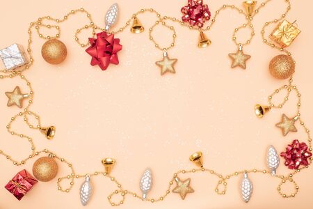 gift box or present box with golden star, bell and ball on golden background for birthday, christmas or wedding ceremonyの写真素材