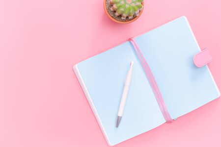 workspace desk styled design office supplies with cactus on pink pastel background minimal styleの写真素材