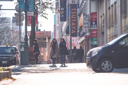 SAPPORO HOKKAIDO, JAPAN - NOV 2018 : people walking on street in rush hour at Susukino District in the winter seasonのeditorial素材