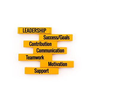 Leadership business concept. yellow wooden block stacking on white backgroundの写真素材