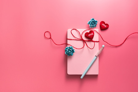 Valentine Day concept, Love daily with red hearts on pink backgroundの写真素材