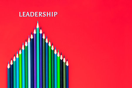 Leadership business concept. green color pencil lead other color on red backgroundの写真素材