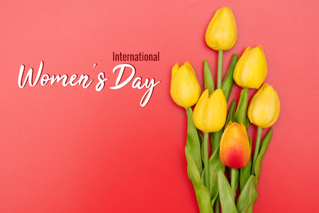 International Womenâs Day with tulip flowers on red backgroundの写真素材